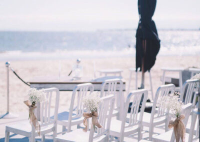 Chairs on the deck set up The Sandbar Beach Cafe