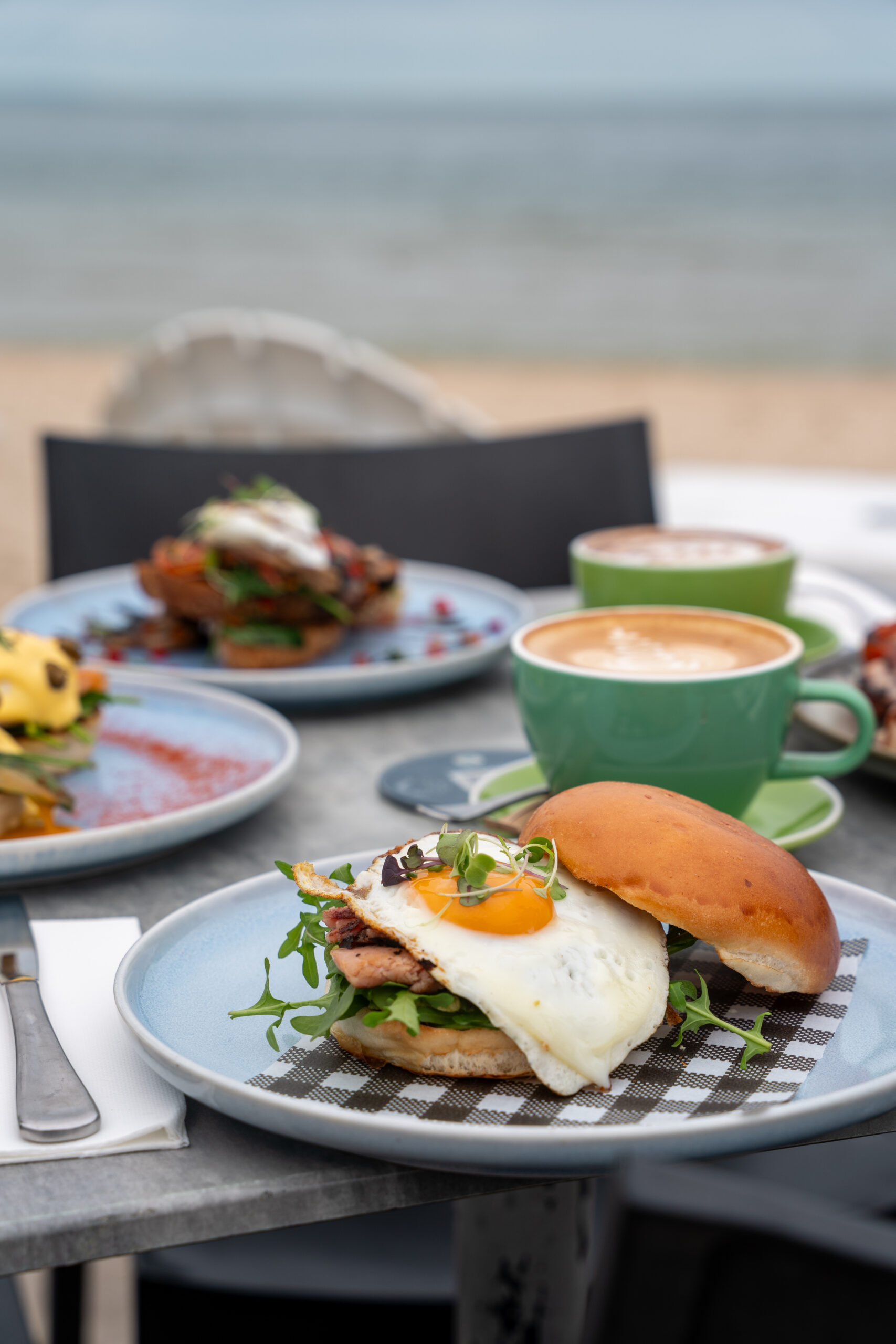 The Brekky Burger with bacon, egg, cheese, relish and avocado at Sandbar Beach Café