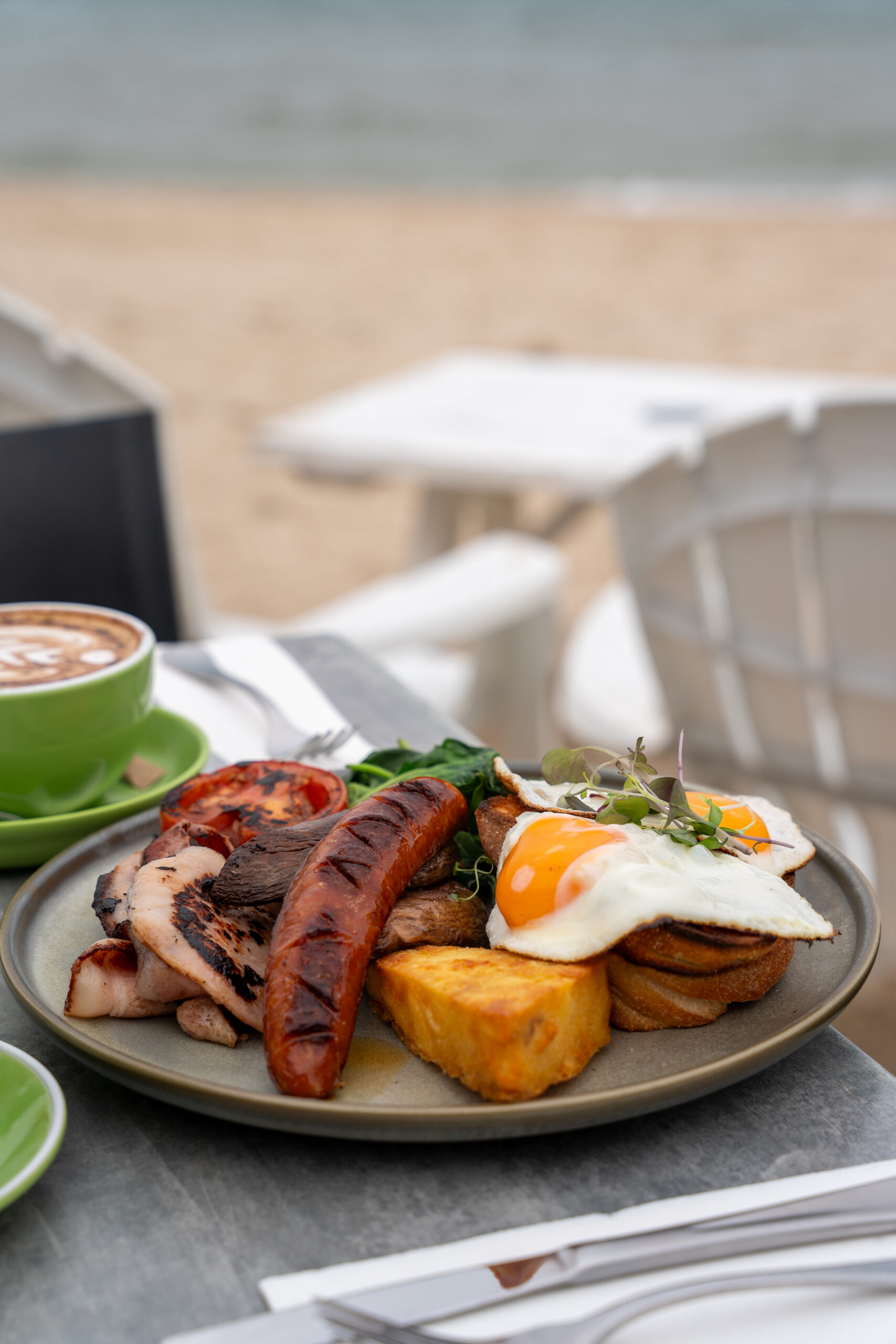 Sandbar Big Brekkie with eggs, bacon, sausage, mushrooms, tomatoes and toast at Sandbar Beach Café